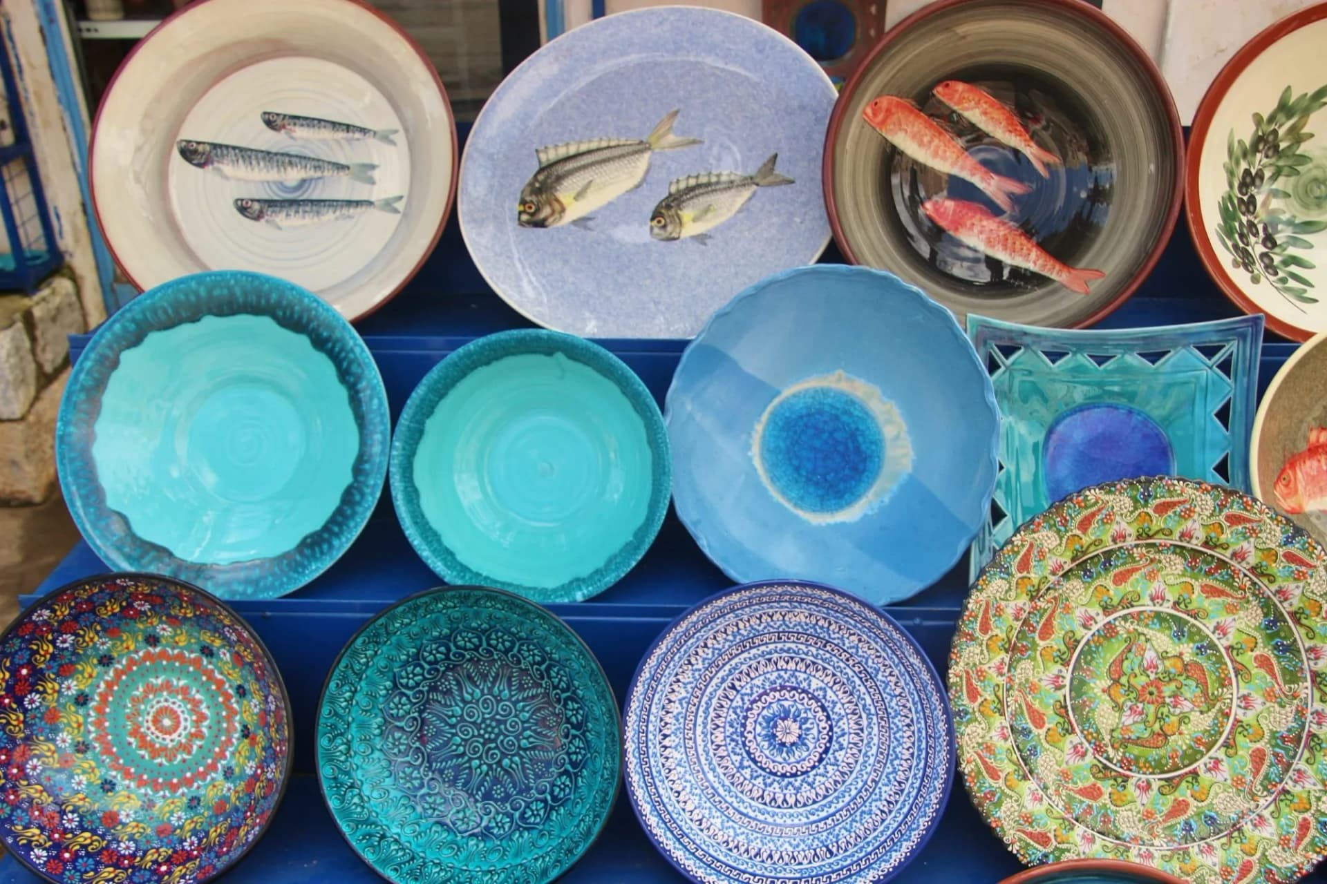 Colorful ceramic souvenirs sold outdoors, in front of a souvenir shop in the village Dirou. In the Inner Mani,  Peloponnese, Greece, South-east Europe.