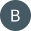 White letter B on dark grey circular background