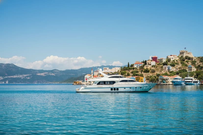 Yacht in bay of Kastelorizo island on sunny summer day, Dodecanese, Greece